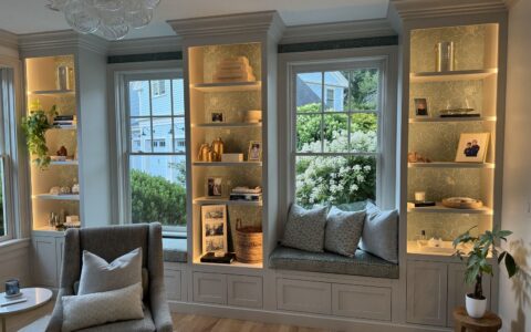 Bay window seat with lit display cabinets