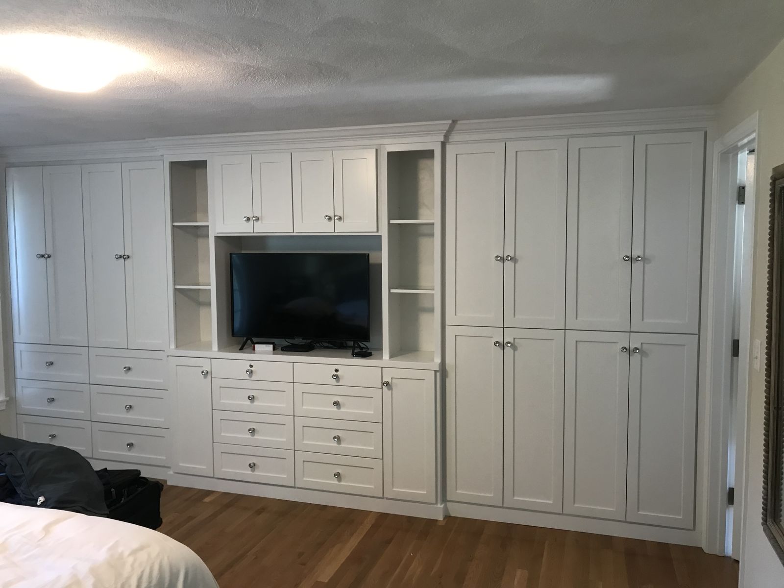 Bedroom built-in wall with TV