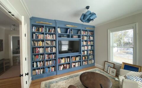 Blue floor-to-ceiling library wall