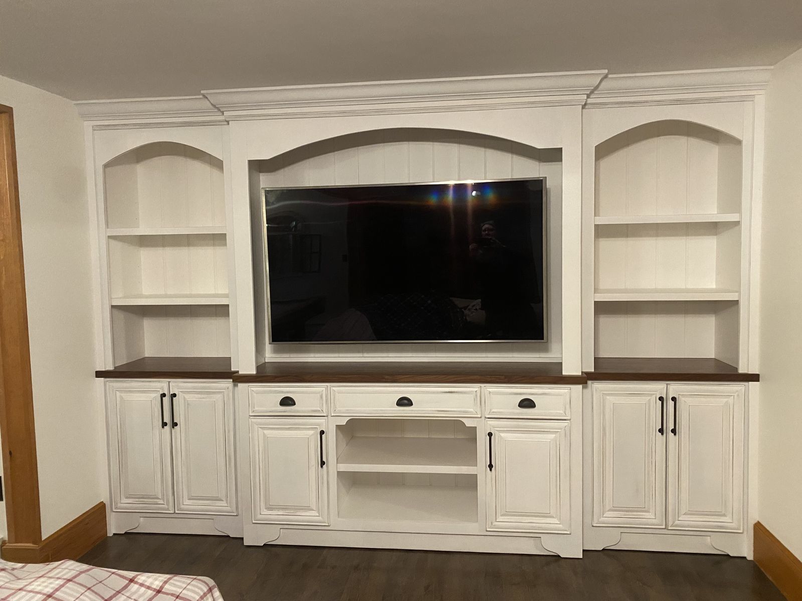 Cream entertainment center with wood counter
