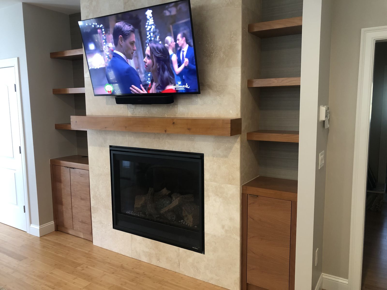 Fireplace surround with TV and floating shelves