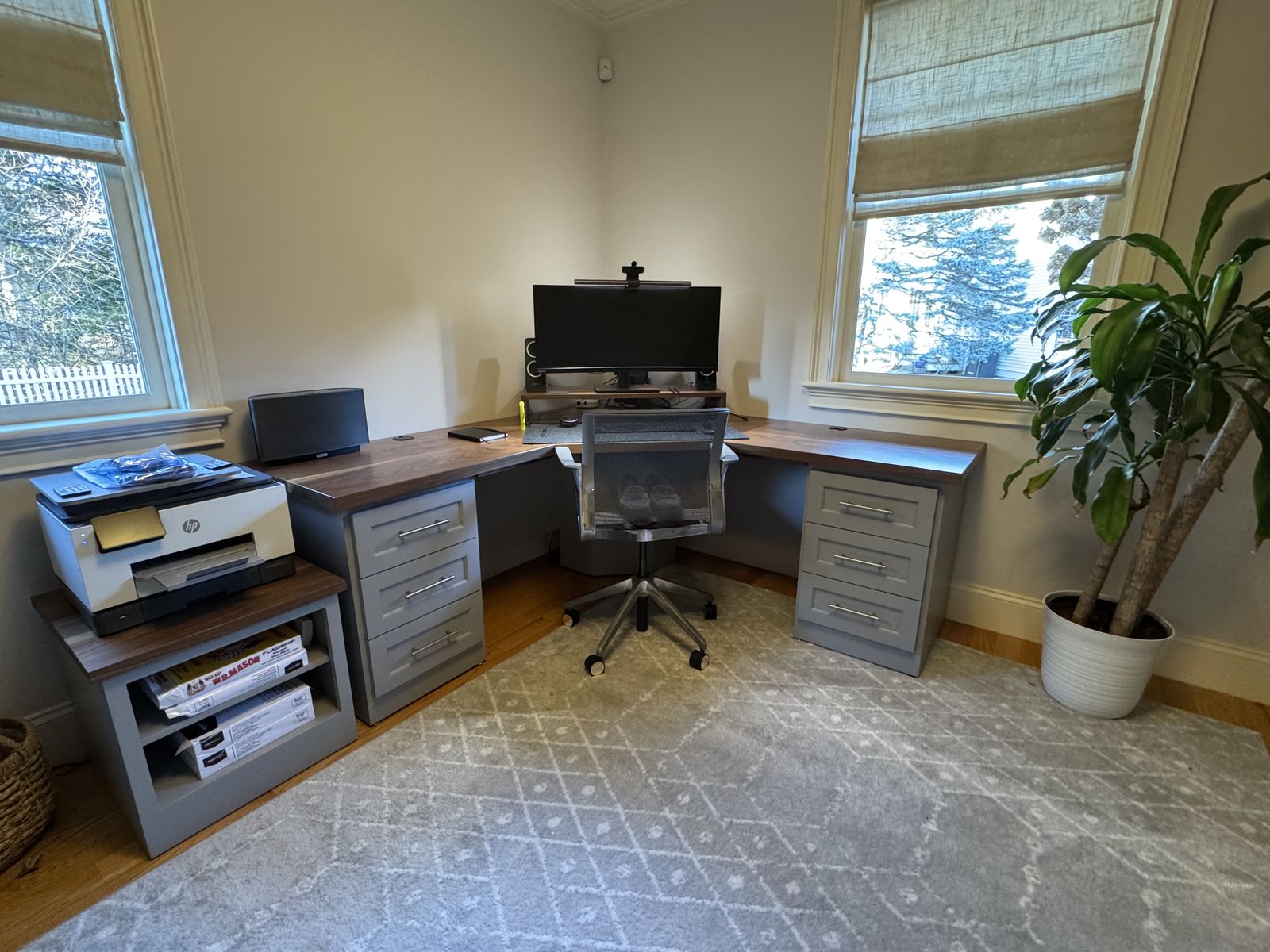 Home office with built-in desk and storage