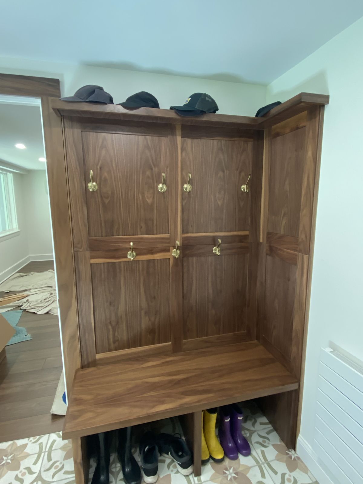 Oak entry bench with hooks and boot storage