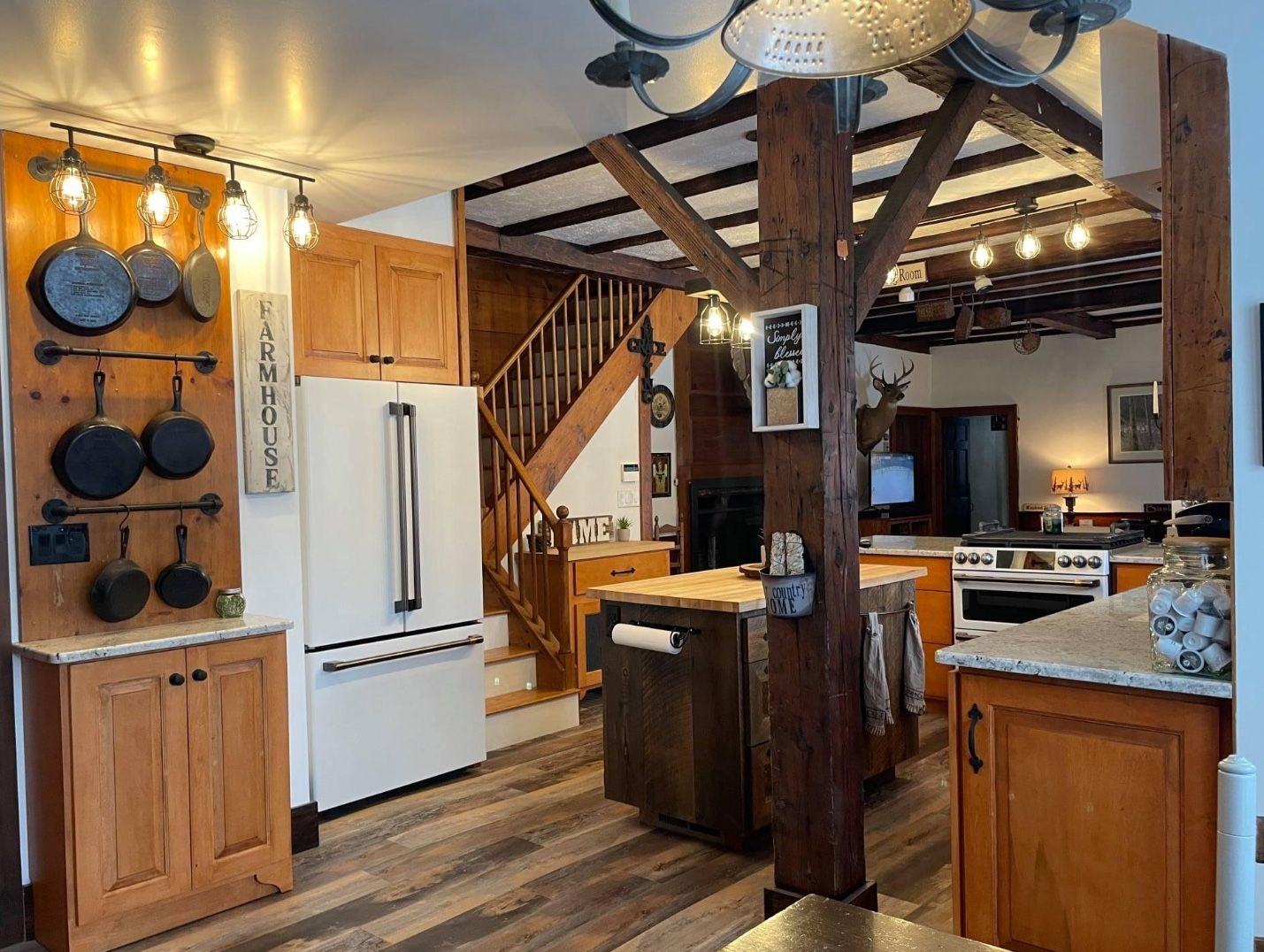 Rustic beamed kitchen with pot rack