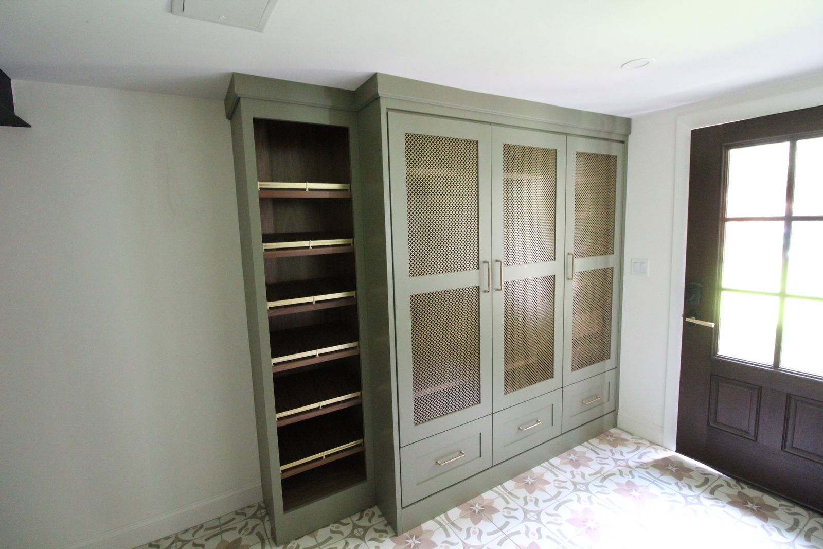 Sage green glass-door cabinet