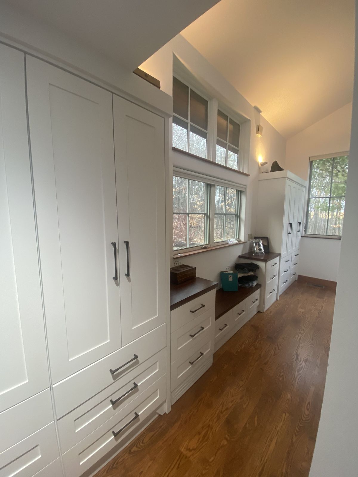 White cabinetry run with glass-front uppers