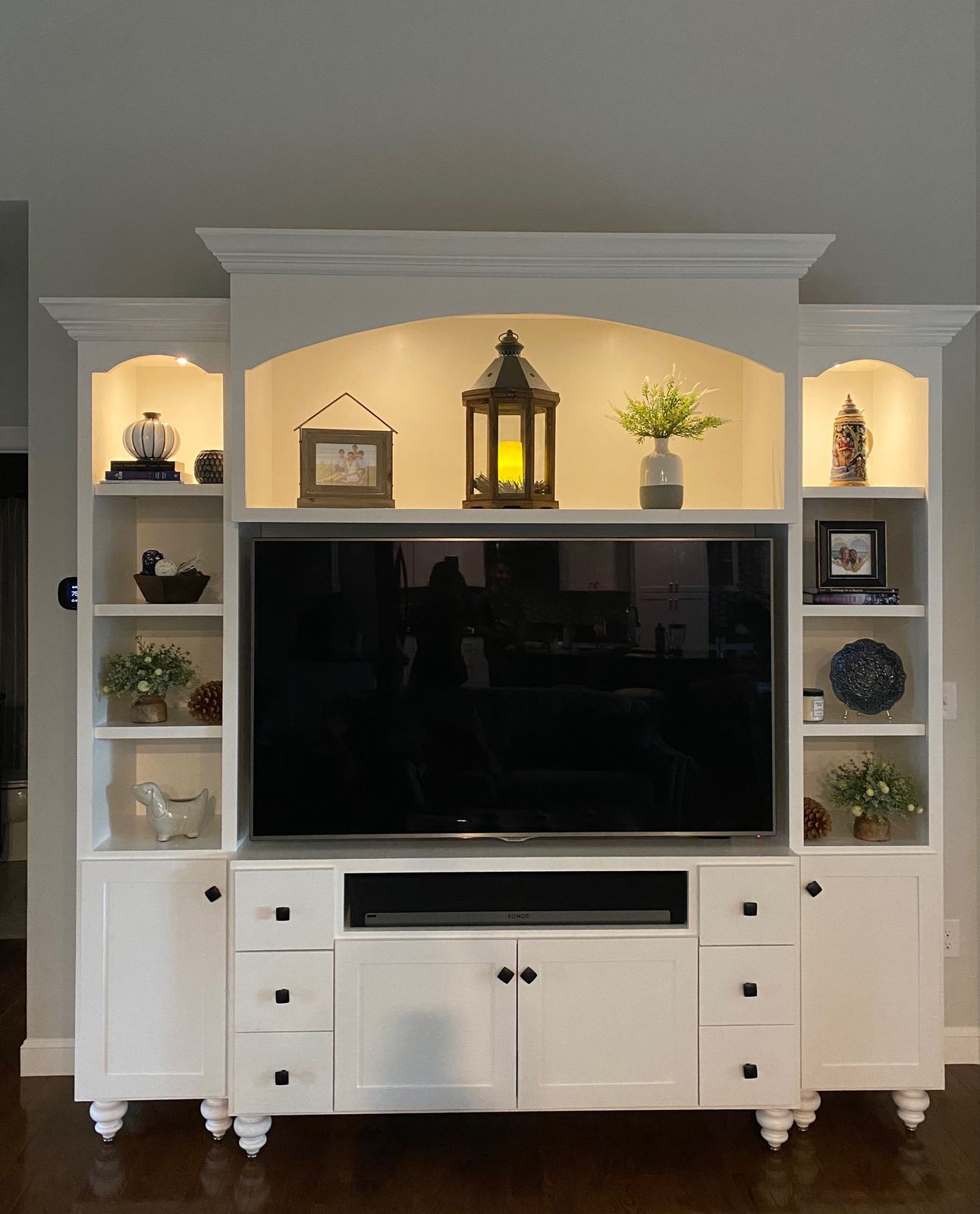 White entertainment center, arched surround