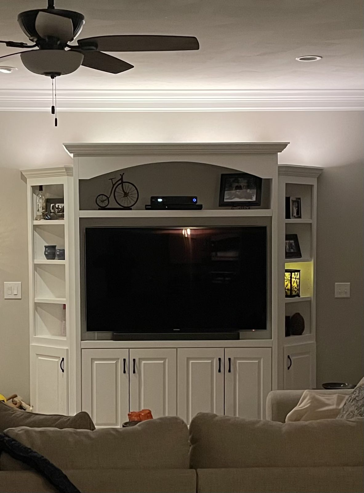 White entertainment center with arched top