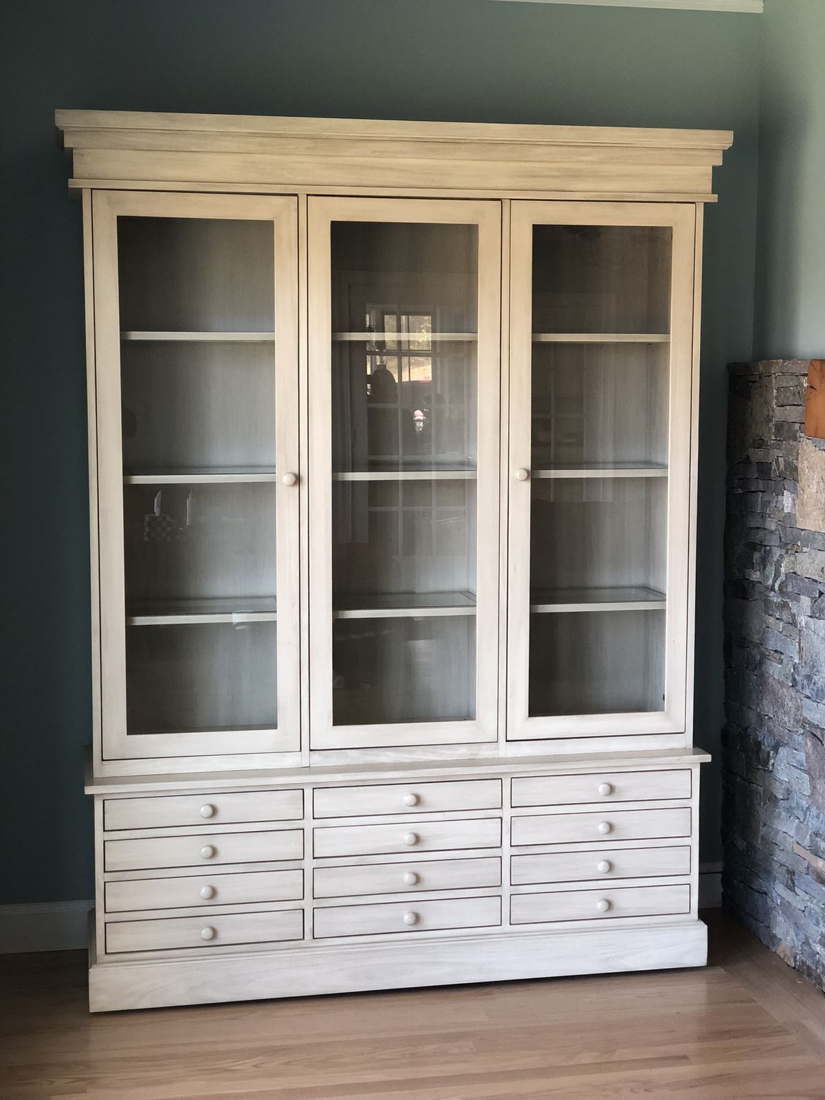 White glass-front display cabinet