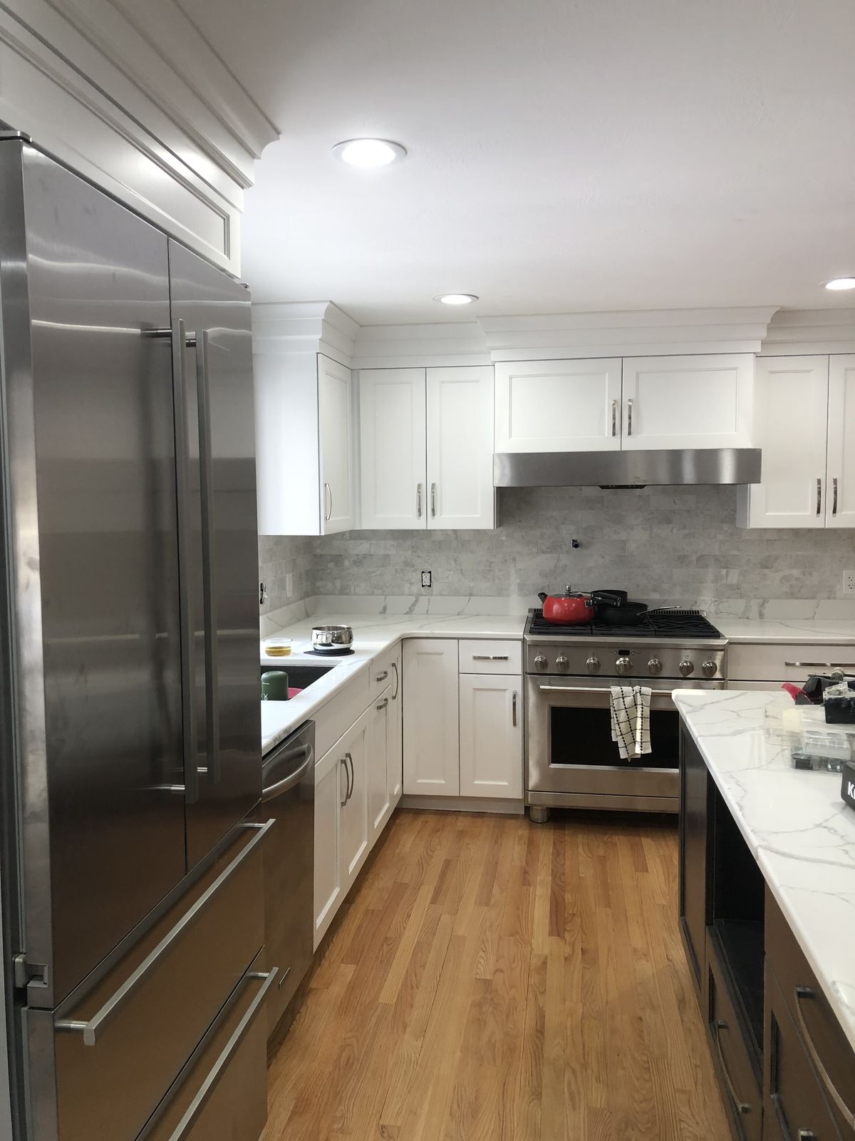 White kitchen with stainless appliances